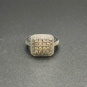 Chocolate and clear diamond ring set in sterling silver, size 6.